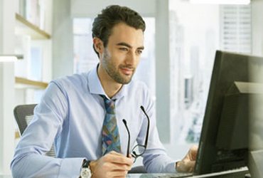 Boy working with a laptop.