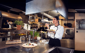 cook tasting a dish