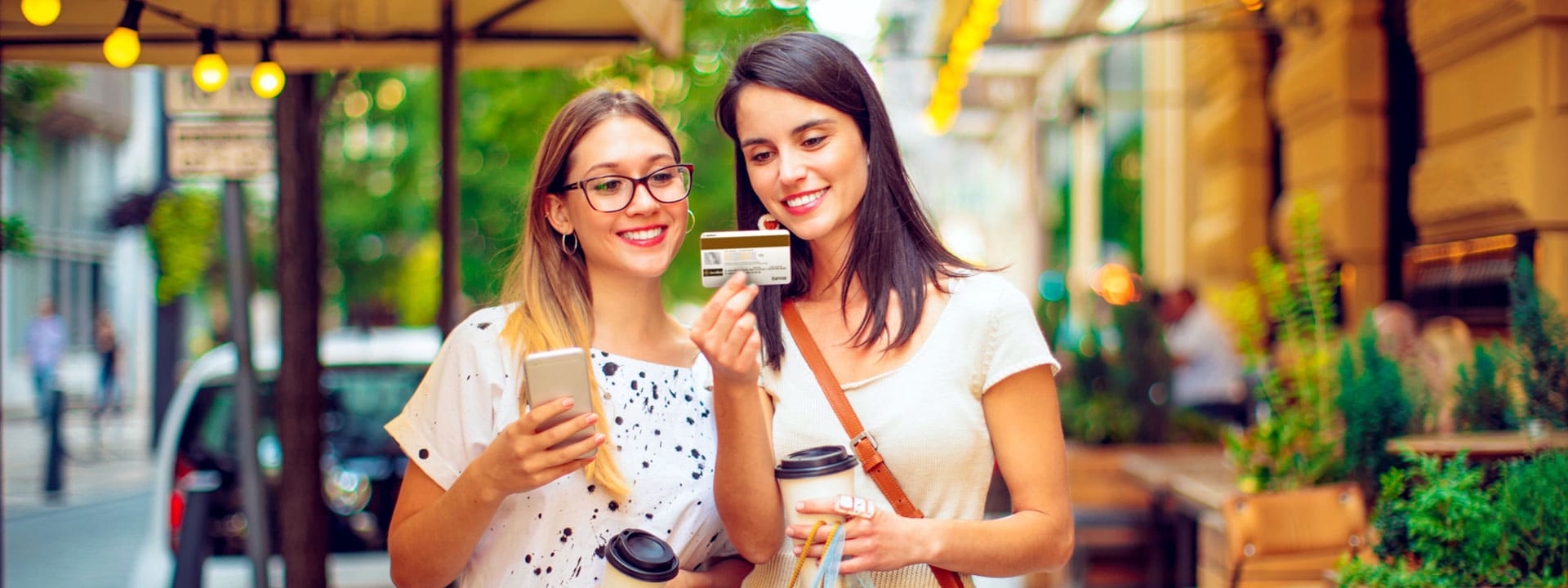 young women looking at a bank card