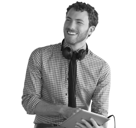 Boy with checkered shirt, tablet and headphones