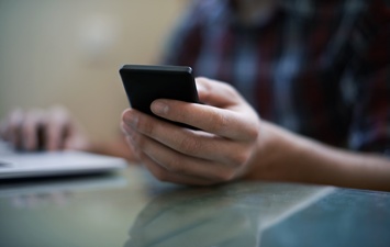 Mobile phone in the hands of a boy