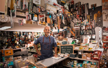 Ironmonger in his shop