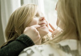 Girl doing reir to its mother