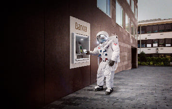 Astronaut withdrawing cash from an ATM